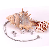 Gold/steel double chain pendant jewelry set in the shape of a small sea turtle with diamonds