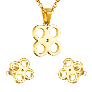 Gold/steel cut jewelry set with four regular round faceted center wisps without diamonds