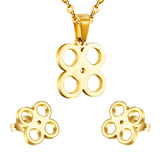 Gold/steel cut jewelry set with four regular round faceted center wisps without diamonds