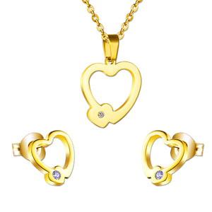 Set of cut jewelry in the shape of a heart x 2 + a small heart with diamonds on the upper door in gold/steel-colored wisps with a glossy finish