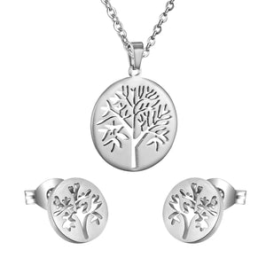 Gold/steel color jewelry set with a smooth surface and a hollow center in the shape of a tree.