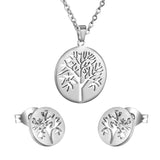 Gold/steel color jewelry set with a smooth surface and a hollow center in the shape of a tree.