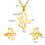 Gold/steel cut jewelry set in the shape of a butterfly with two tentacles without diamonds