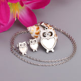 Gold/steel owl with diamonds on surface + shells glued on body jewelry set