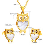 Gold/steel owl with diamonds on surface + shells glued on body jewelry set