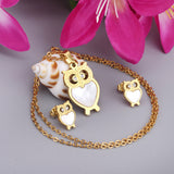 Gold/steel owl with diamonds on surface + shells glued on body jewelry set