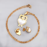 Gold/steel owl with diamonds on surface + shells glued on body jewelry set