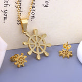 Steel/golden faceted cut jewelry set in the shape of a boat tiller without diamonds