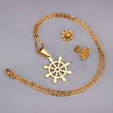 Steel/golden faceted cut jewelry set in the shape of a boat tiller without diamonds