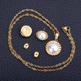 Gold/steel half pearl standing on top of round cake jewelry set