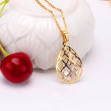 Gold/steel emery mesh hollowed out teardrop interior + diamond jewelry set