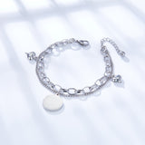 Bracelet double rond + 2 accessoires en forme de cœur