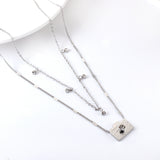 Caméra en acier inoxydable avec diamants + collier double chaîne 5 diamants ronds